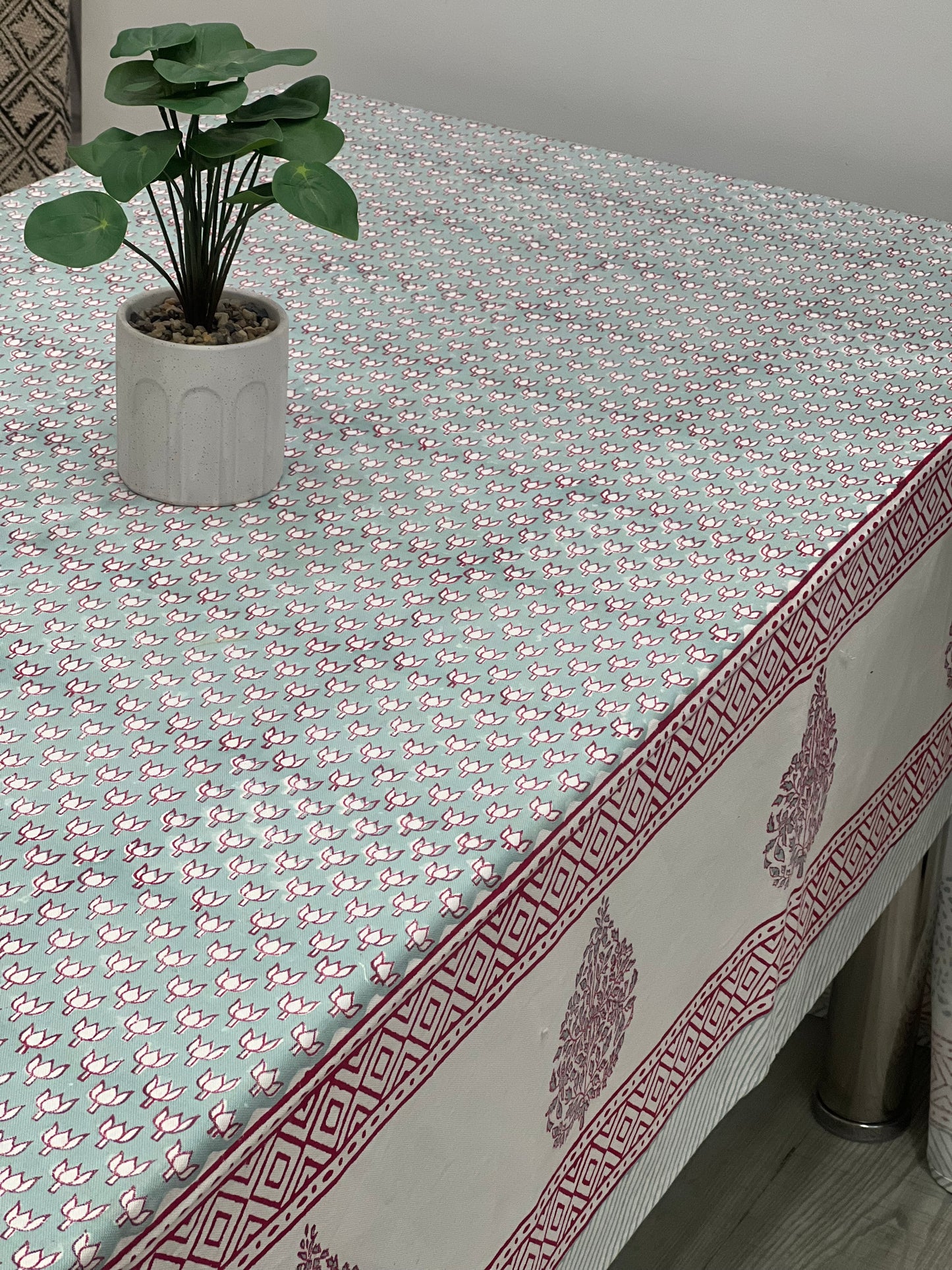 "Tranquil Lotus Greens: Green Tablecloth with Small Lotus Motifs"