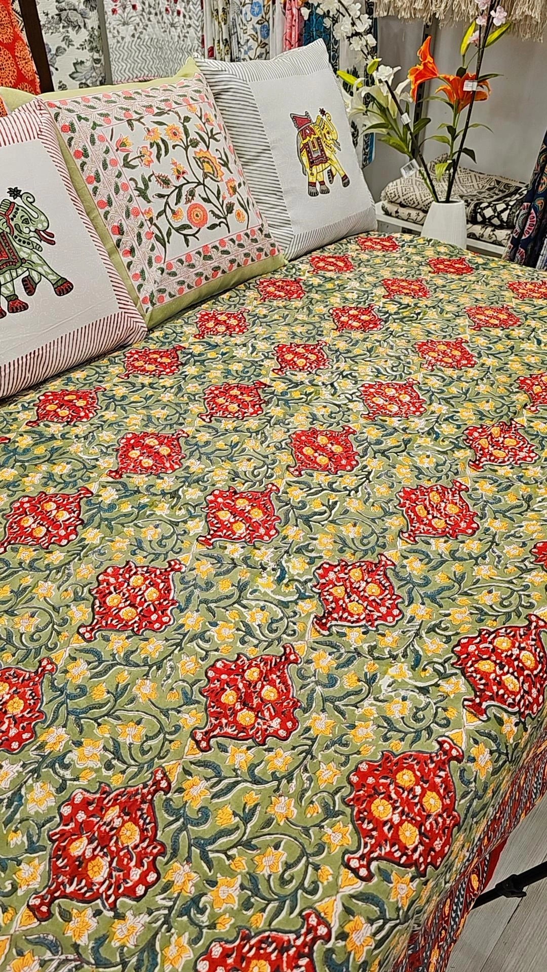 "Sunflower Meadow: Green, Red, and Yellow Floral Quilt"