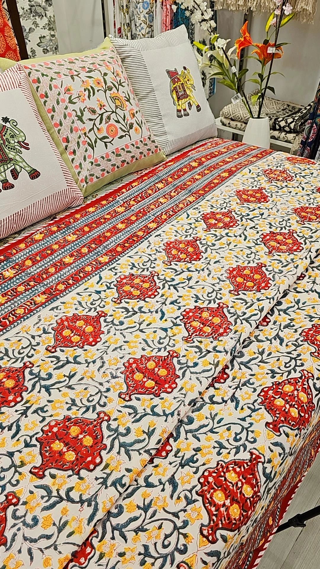 "Sunflower Meadow: Green, Red, and Yellow Floral Quilt"