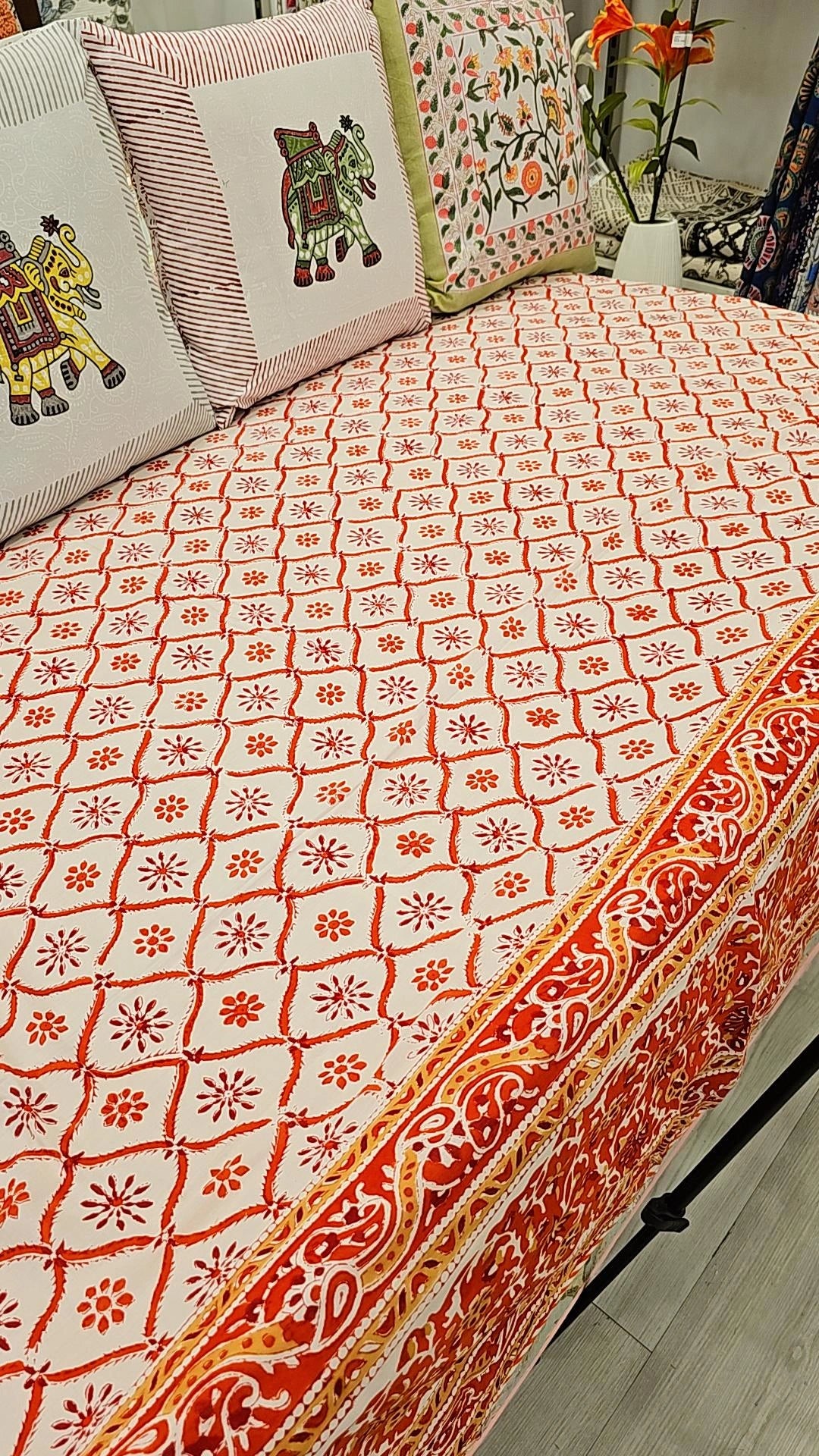 "Sunset Blooms: Orangish Red Floral Patterns Quilt"