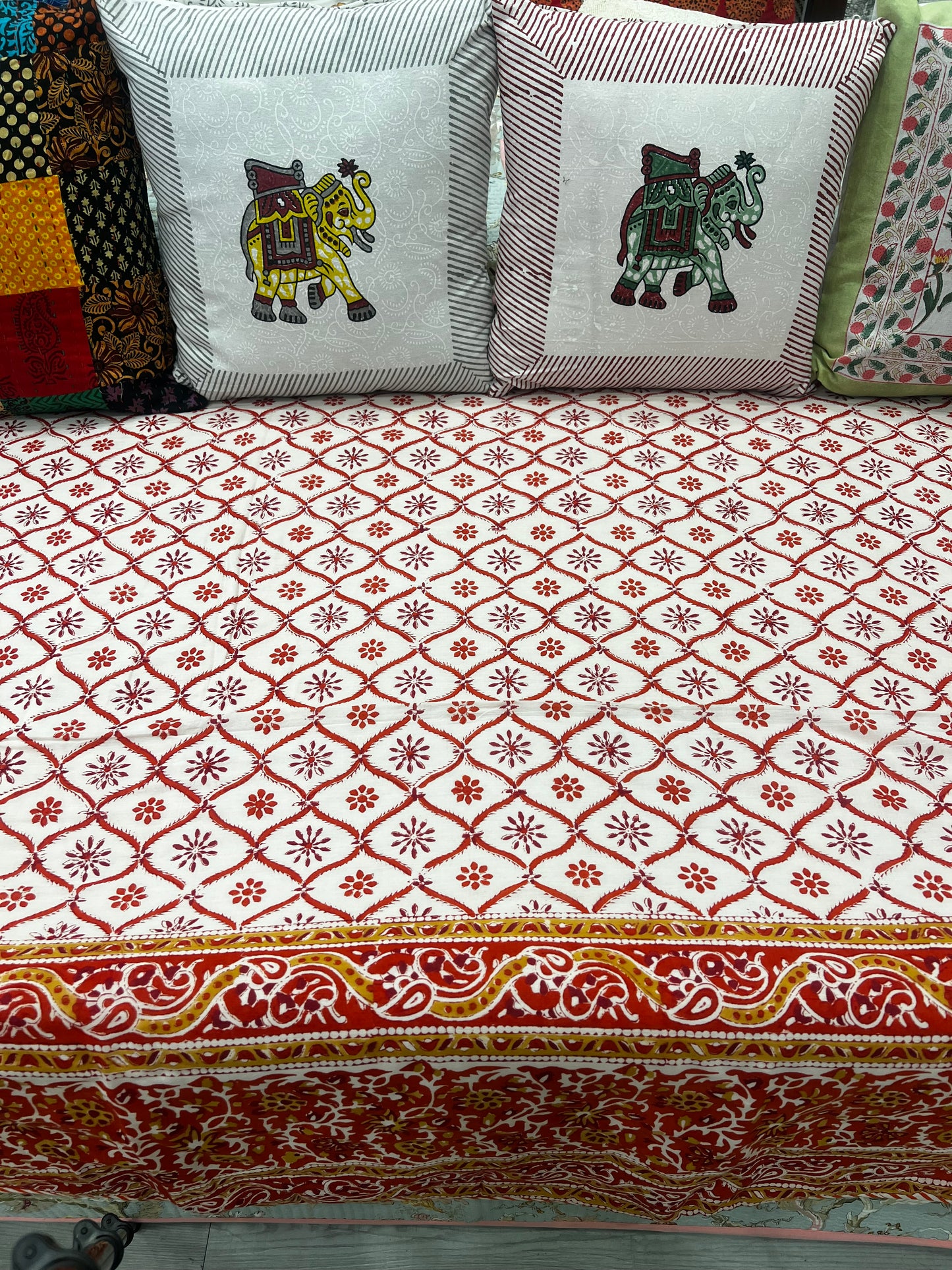 "Sunset Blooms: Orangish Red Floral Patterns Quilt"