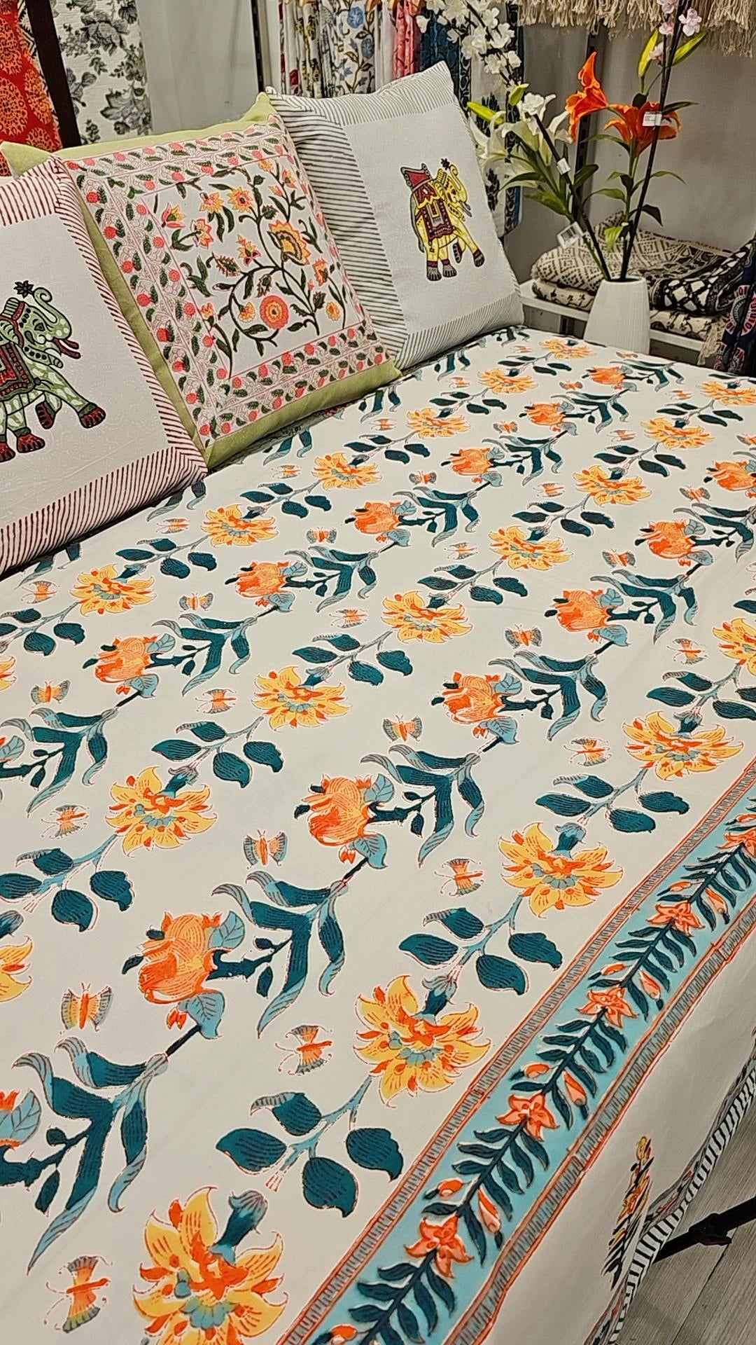 "Harvest Blossoms: Green and Orange Floral Off-White Quilt"