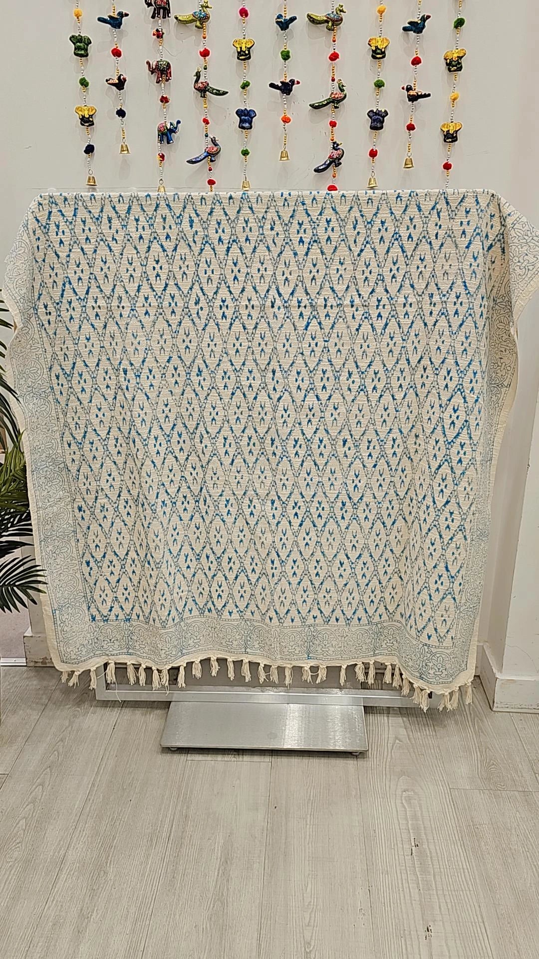 Beige and black geometric print throw