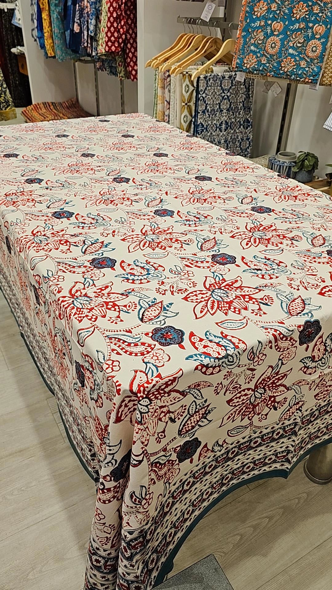 "Crimson Blossoms: White and Red Floral Tablecloth"