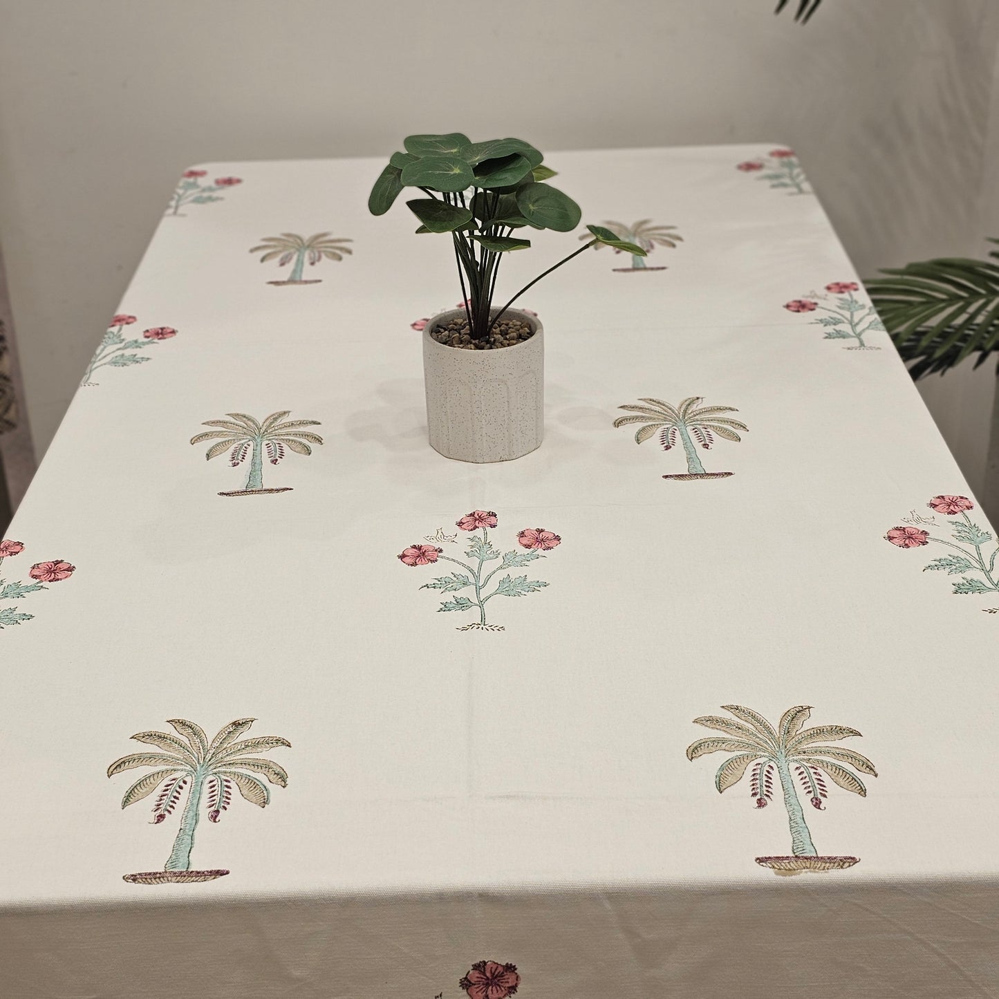 "Whispering Palms: Off-White Tablecloth with Pink Florals"