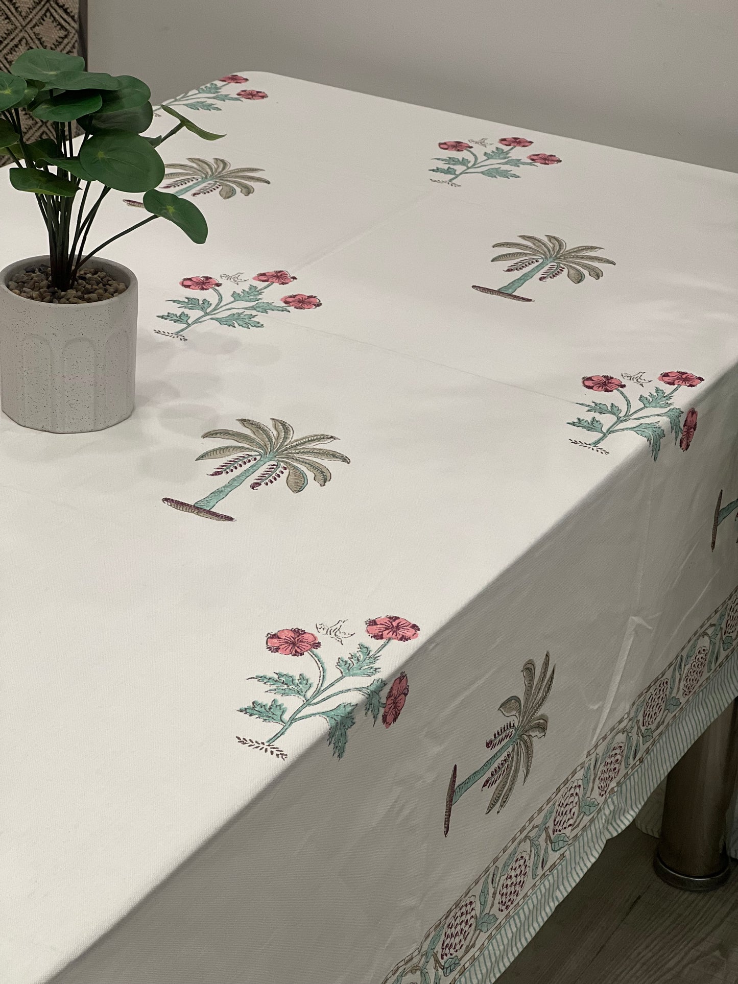 "Whispering Palms: Off-White Tablecloth with Pink Florals"