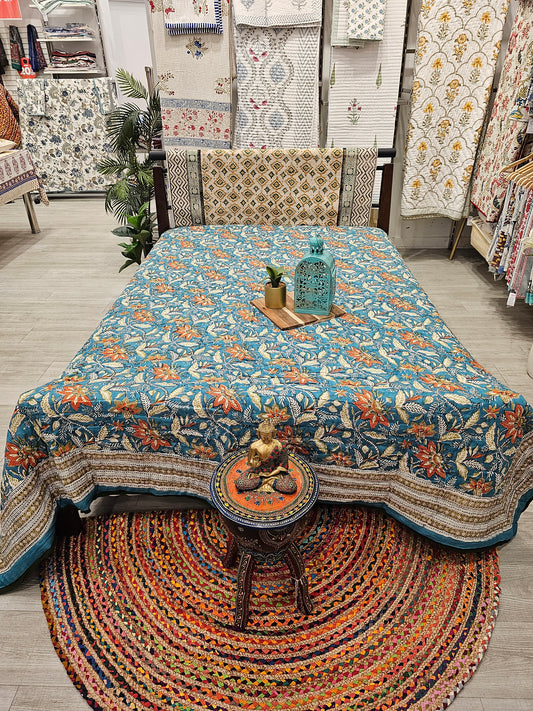 "Blooming Hues: Teal Green and Orange Floral Winter Quilts"
