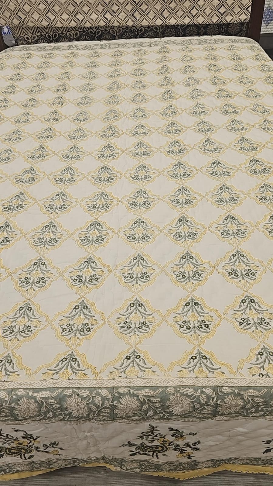 white and beige floral block print winter quilt